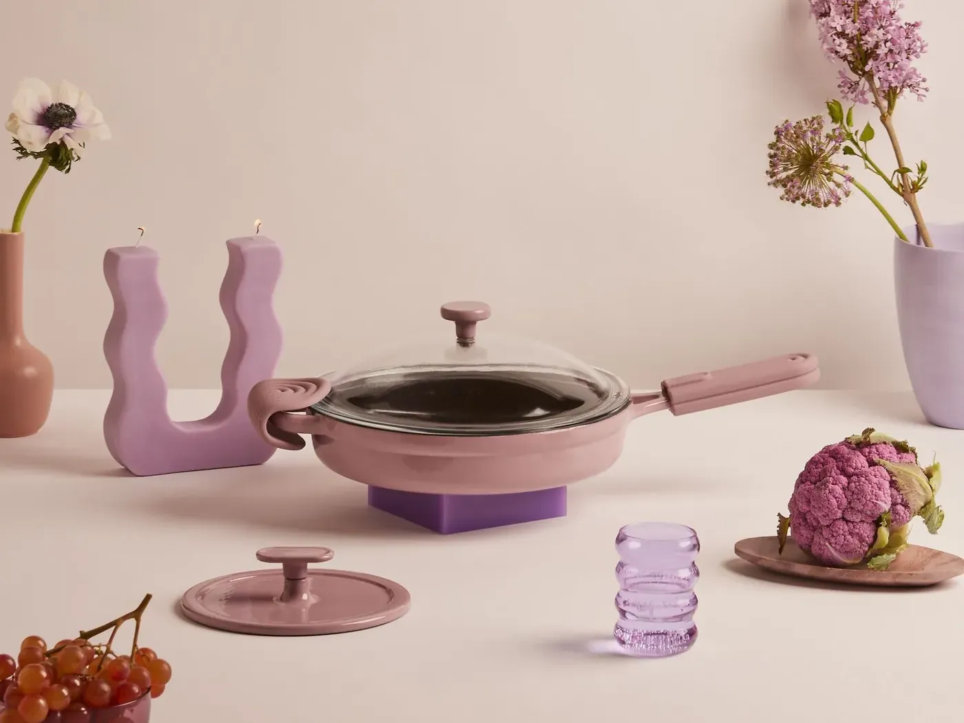 The Always Pan in lavender with its lid, spatula and a nesting steamer basket