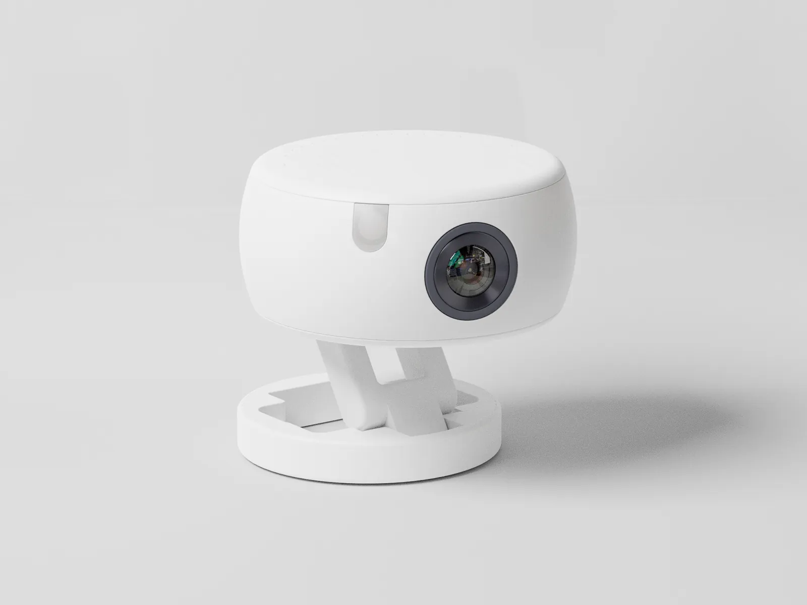 The sensor unit: a white puck with a camera lens, tilted on a folding stand over a round base