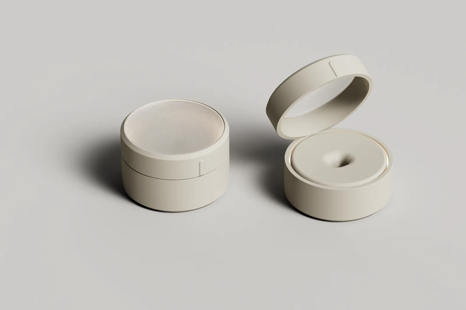 Render of a short cylindrical puck base station with a straight-sided lid