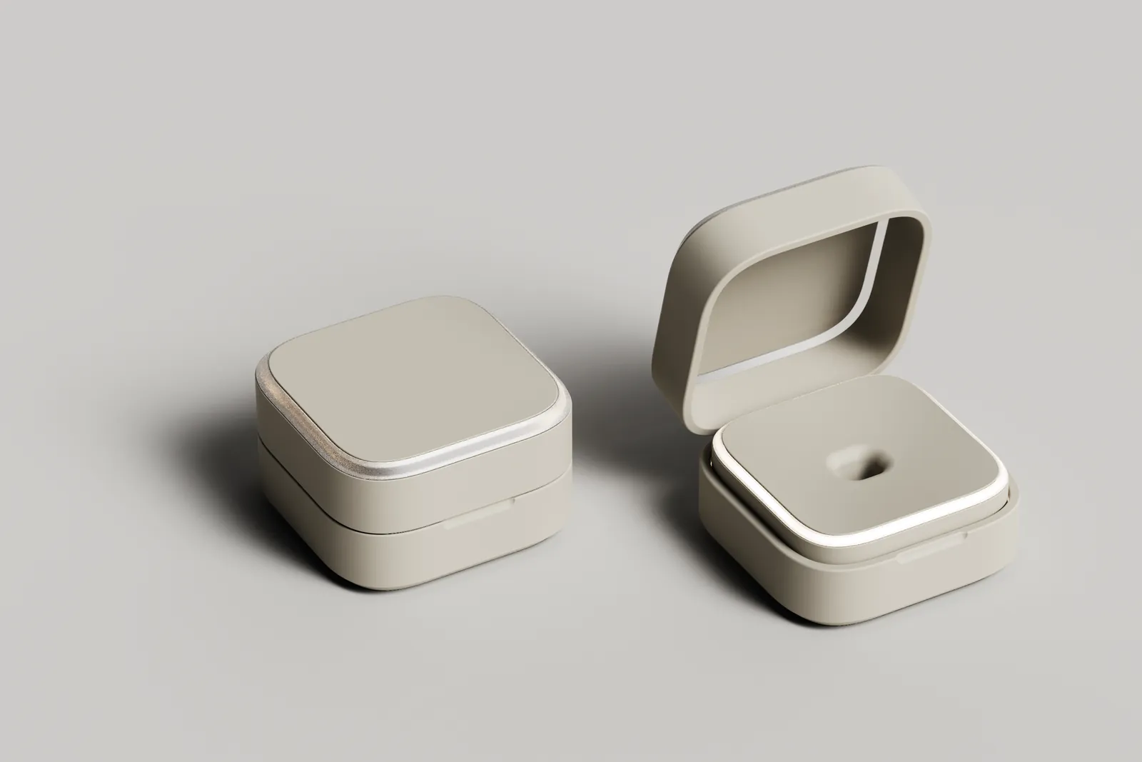 Render of a squared-off base station with a metal rim and a flat lid