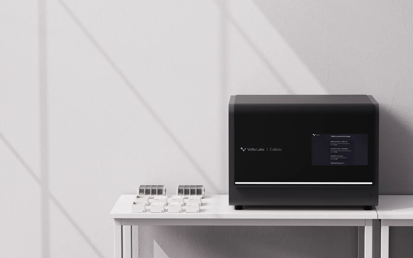 Callisto on a white lab table with labware beside it