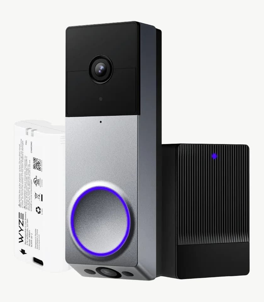 The shipped silver Duo Cam Doorbell with its battery and the black ribbed chime